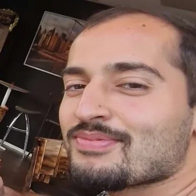 ALI A.